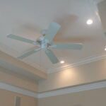 An Image Of A Room'S Ceiling With Coving, Recessed Lighting, And A Ceiling Fan. The Coving Enhances The Room'S Architecture, Providing A Classic And Finished Look